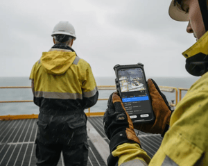 Worker holding Xshielder explosion-proof iPhone 16 Pro Max